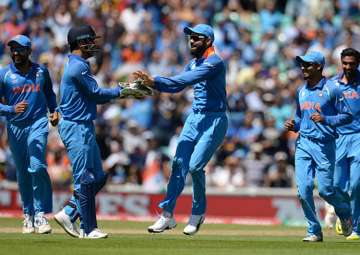 Virat Kohli celebrates the dismissal of a South Africa batsman.