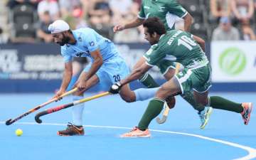 Talwinder Singh of India and Ali Shan of Pakistan battle for possession 