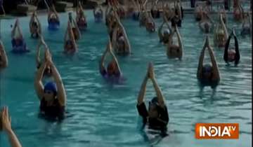 1000 women practice water yoga