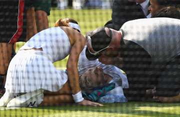 Bethanie Mattek-Sands of USA receives treatment from the medical team