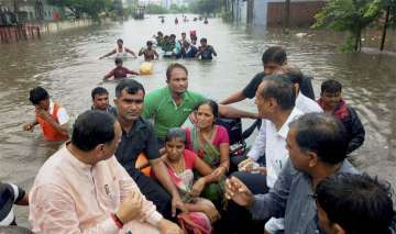 Vijay Rupani with flood affected people