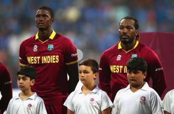 Jason Holder and Chris Gayle of the West Indies look on during the anthems