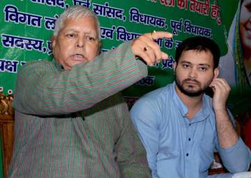 Lalu Prasad addressing a press conference with Tejashwi Yadav in Patna