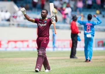 Evin Lewis reacts after reaching to his hundred.