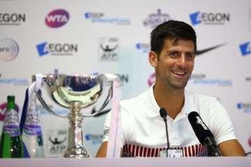 Novak Djokovic of Serbia chats to media after winning the Eastbourne title