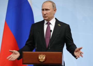 Putin gestures during a press conference after G20 Summit in Hamburg