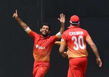 Sikander Raza celebrates a wicket.