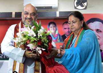 Amit Shah being felicitated by CM Raje during a party programme in Jaipur