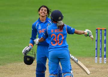 Smriti Mandhana celebrates her century against West Indies.