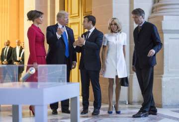 Trump, Macron and their wives chatting after their tour to a museum