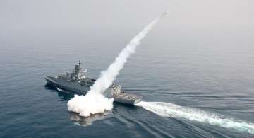  A South Korean navy ship fires a missile during a drill in East Sea