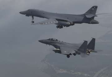 A US Air Force B-1B bomber flies with South Korean fighter jets F-15K