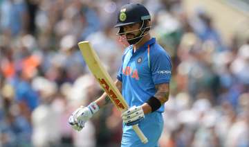 Virat Kohli of India leaves the field after being dismissed
