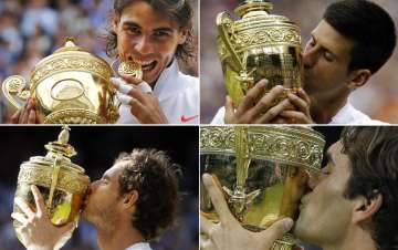 A file photo of Nadal, Djokovic, Murray, Federer kissing the Wimbledon trophy