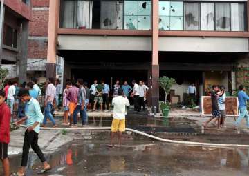 File pic - Supporters of Dera Sacha Sauda set ablaze shops in Panchkula