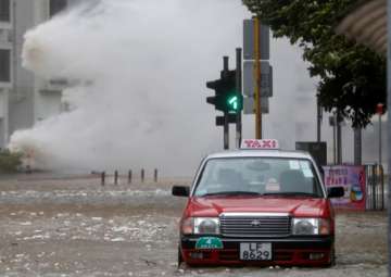 Hong Kong shuts down as powerful typhoon sweeps past