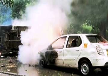 Panchkula: A vehicle burns during arson following Ram Rahim’s conviction