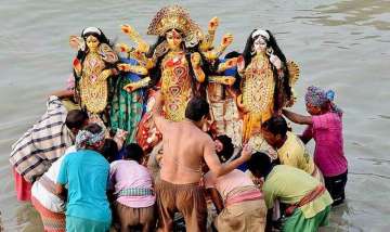 Idol immersion during Durga Puja. Photo PTI