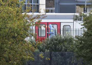 A forensics officer on the platform at Parsons Green station in west London