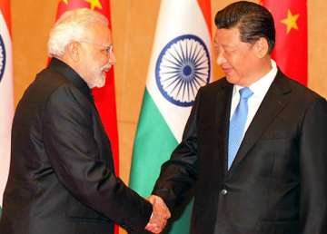 Chinese President Xi Jinping greets Prime Minister Narendra Modi ta BRICS Summit
