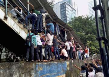 Passengers caught in a stampede at Elphinstone railway station's foot overbridge