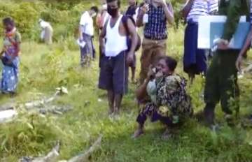 Hindu woman weeps at a site