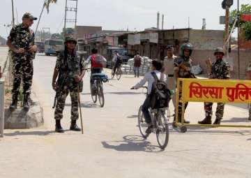 Security forces stand guard at Satnam Chowk, the main entrance to Dera HQs