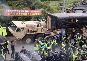 US adds launchers to THAAD as dozens hurt in South Korea protests