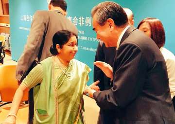 ASushma Swaraj, Chinese foreign minister Wang Yi exchange greetings at UN