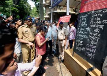 Elphinstone stampede: Relatives check for the names of injured victims 