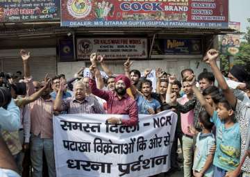 File pic - Traders shout slogans during a protest against the ban on the sale of firecrackers Delhi