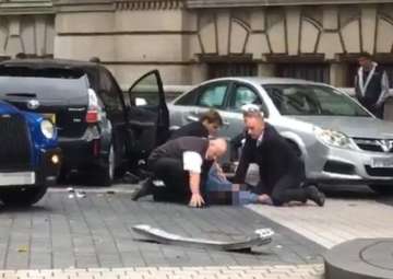 Car hits crowd near London museum, many injured