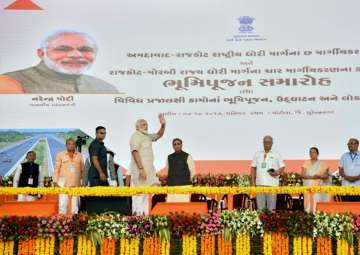 PM Modi presides over 'bhumi pujan' of greenfield airport at Hirasar