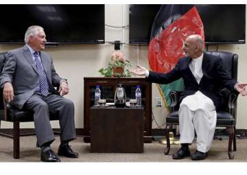 Rex Tillerson speaks with Ashraf Ghani at the Bagram Air Field in Afghanistan