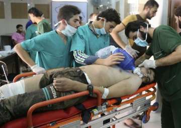 File pic - Medical staff treating a man suffering from breathing difficulties inside a hospital in Aleppo, Syria after a chemical attack