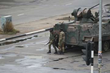 Zimbabwe army has Mugabe, wife in custody, controls capital; denies coup