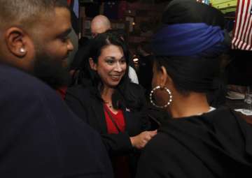 Kelly Convirs-Fowler greets her supporters as results come in Tuesday in Virginia Beach