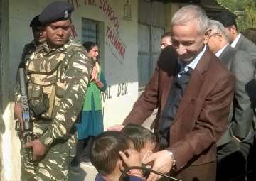 Dineshwar Sharma during a visit to a government primary school at Talwara