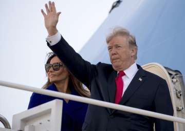Donald Trump and first lady Melania Trump board Air Force One at Andrews Air Force Base