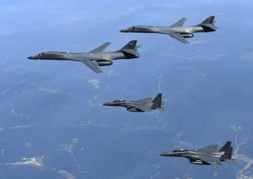 File - US Air Force B-1B bombers and South Korean fighter jets F-15K fly over the Korean Peninsula
