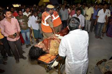 An injured being taken to a hospital in Vijayawada after an overloaded boat capsized in Krishna river on Sunday.
