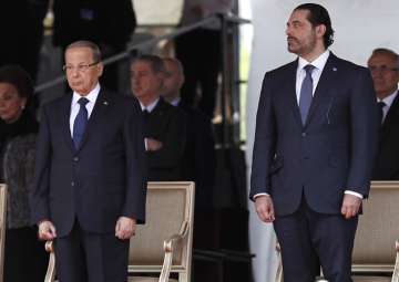 Lebanese President Michel Aoun and PM Saad Hariri attend a military parade to mark the 74th anniversary of Lebanon's independence from France

