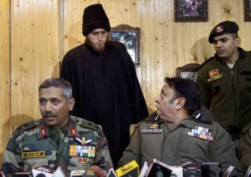 Majid Arshid, the footballer-turned militant, being presented before the media during a joint press conference at Awantipora in Pulwama district