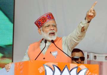 Narendra Modi addresses an election campaign rally in support of BJP candidates in Kangra district