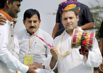 File pic - Rahul Gandhi plays a musical instrument at an interaction program at Harij in Patan district