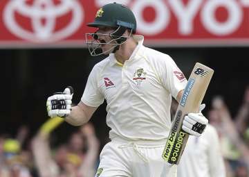 Steve Smith celebrates after he reached 100 runs during the Ashes cricket test between England and Australia in Brisbane
