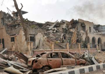 File pic - Damage in the eastern Syrian city of Deir Ezzor during a military operation by government forces against ISIS
