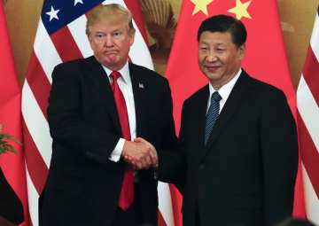 Donald Trump poses with Xi Jinping for a photo after a joint press conference at the Great Hall of the People in Beijing