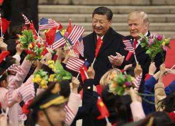 President Donald Trump and Chinese President Xi Jinping participate in a welcome ceremony on Nov 9 at the Great Hall of the People in Beijing, China.