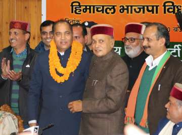 Shimla: Former CM PK Dhumal and other leaders congratulating Jairam Thakur after he was chosen as the BJP's Legislature party leader at a meeting, in Shimla on Sunday